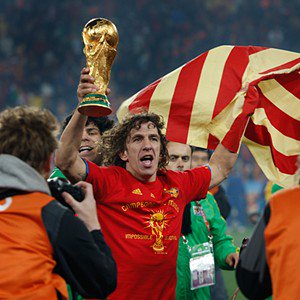 Carles Puyol - , SOUTH AFRICA - JULY 11: Carles Puyol of Spain celebrates the victory with the trophy  during the  World Cup match between Holland  v Spain  on July 11, 2010 (Photo by Dale Macmillan/Soccrates/Getty Images)