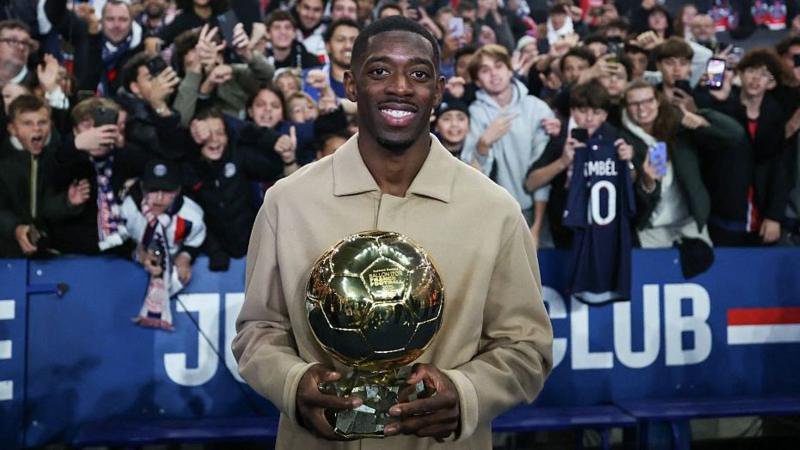 Ousmane Dembele shows off his Ballon d"Or