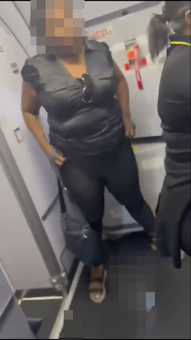 The woman claims in the video she was denied access to the bathroom for two hours. She is seen here lifting her pants at the end before she walks away