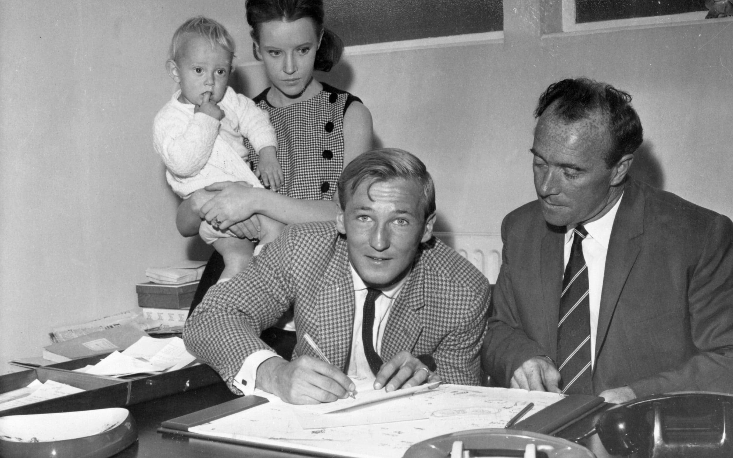 Dobing, watched by his family and the Stoke City manager Tony Waddington, signs for the club in 1963