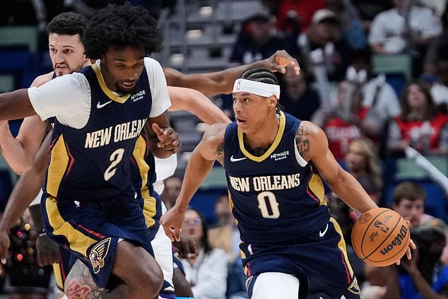 New Orleans Pelicans guard Jeremiah Fears (0) drives down court against the Sacramento Kings in the first half of an NBA basketball game, Thursday, Oct. 29, 2026, in New Orleans. (AP Photo/Gerald Herbert)
