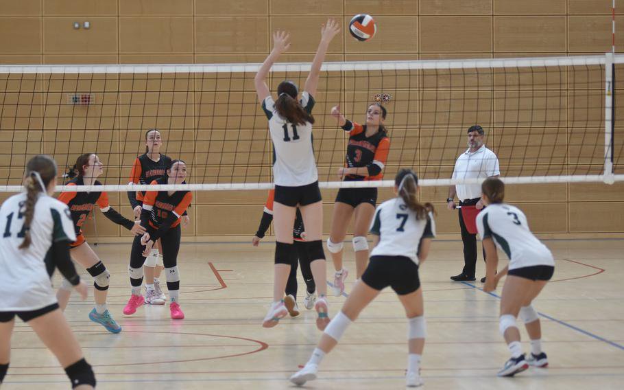 AFNORTH’s Ellie McPhee leaps to block a shot by Spangdahlem’s Emily Castano during the finals on Saturday, Oct. 31, 2026, of the 2026 DODEA Division III European girls volleyball championships in Spangdahlem, Germany. Spangdahlem won the title in a close, five-set match, 25-17, 22-25, 25-7, 19-25, 15-11.