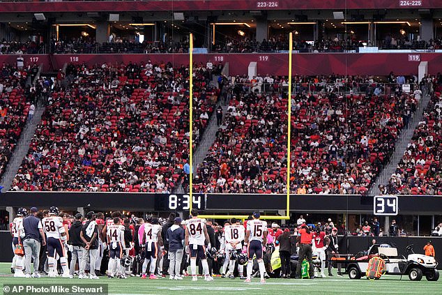 Emotional Falcons teammates were seen encircling Daniels as he was removed from the field