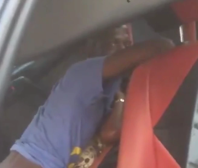 Video: Taxi driver caught on camera chopping a female passenger who couldn't afford her fair