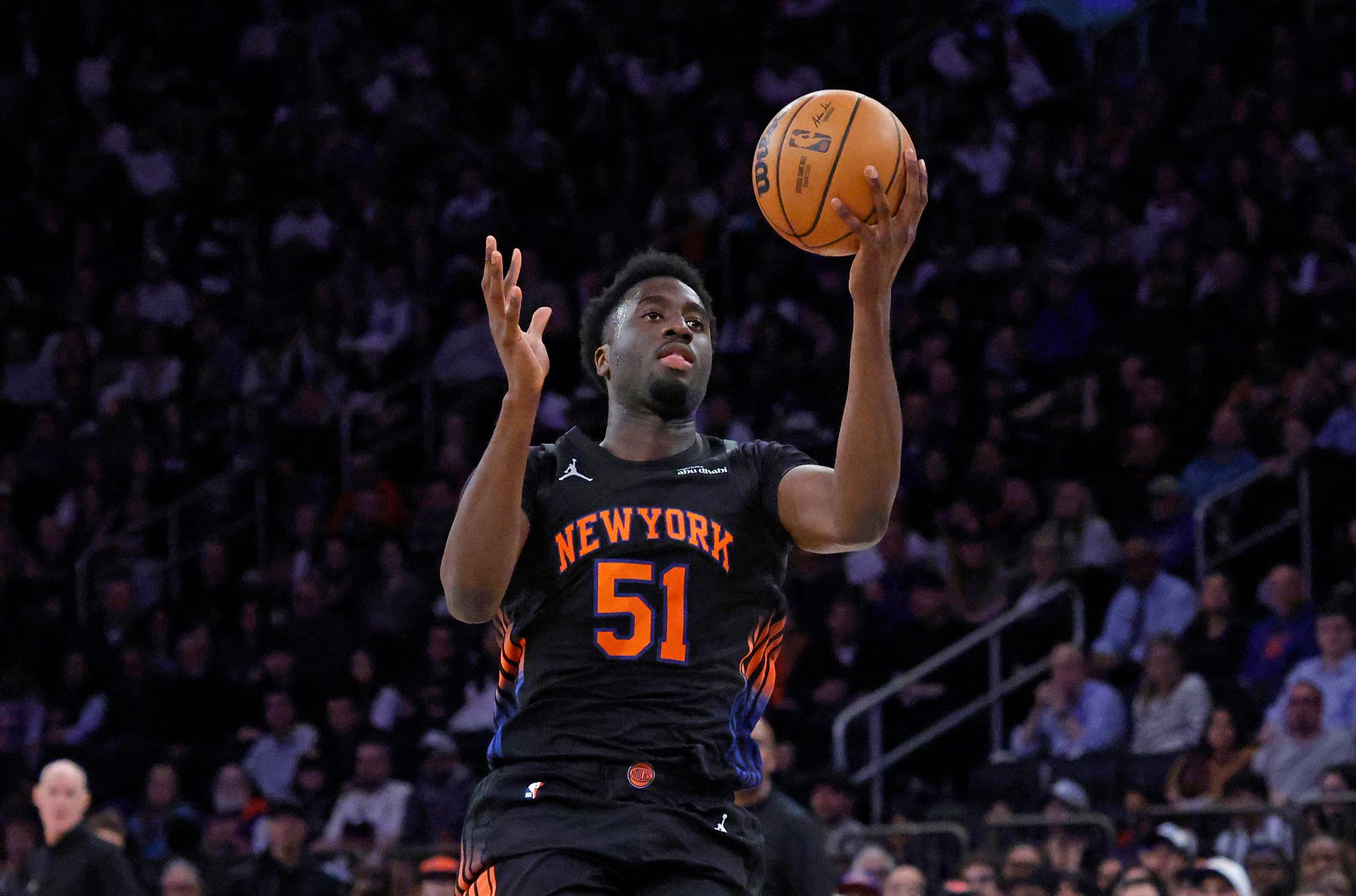 New York Knicks forward Mohamed Diawara reaches for a rebound during a game against the Toronto Raptors.