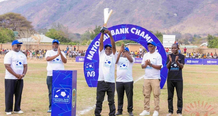 Chigwenembe Lifts A Trophy As Nbm Plc And Fam Delegates Look On 002- Malawi24