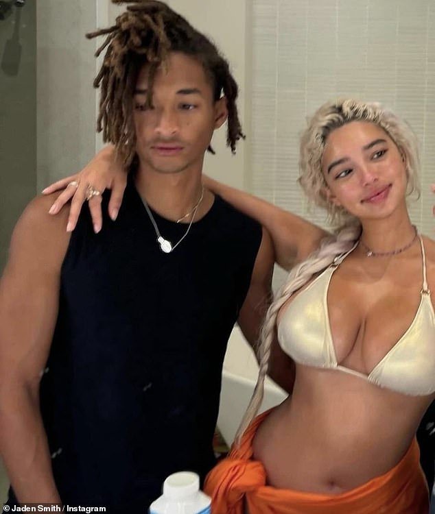 Jaden recently shared a mirror snap of him and Sab. The gorgeous songstress wore a gold bikini top and an orange sarong, with her long hair in a braid
