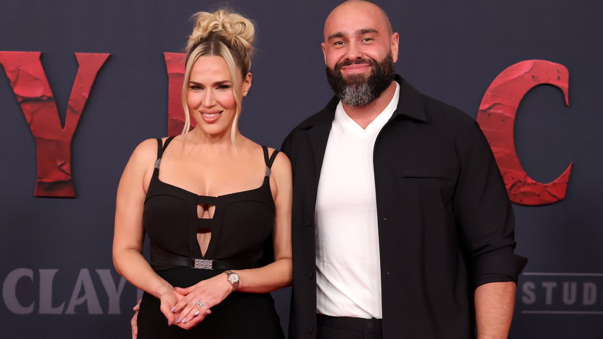 CJ Perry and Miro pose together at Clayface premiere.