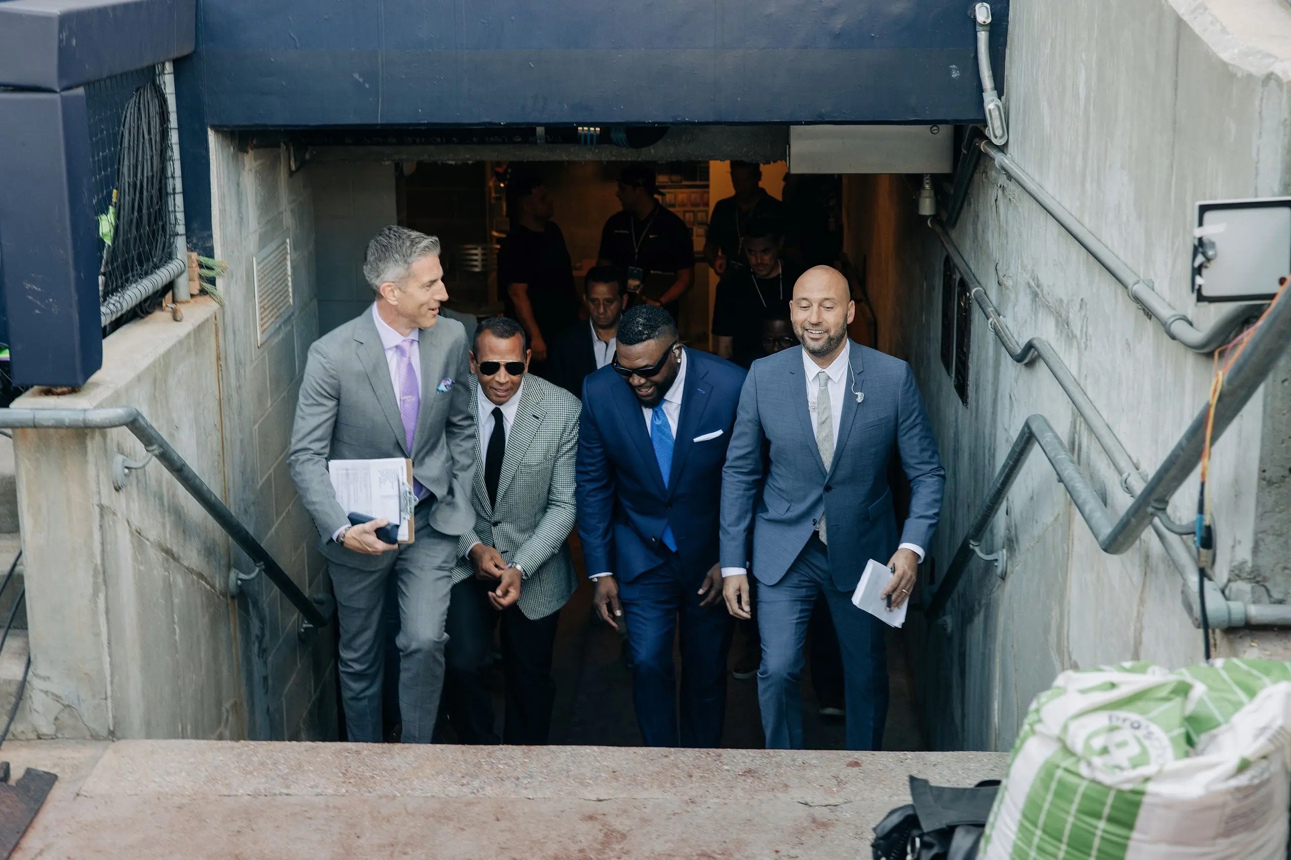 (From left to right) Kevin Burkhardt, Alex Rodriguez, David Ortiz and Derek Jeter of the MLB on Fox studio crew walking.
