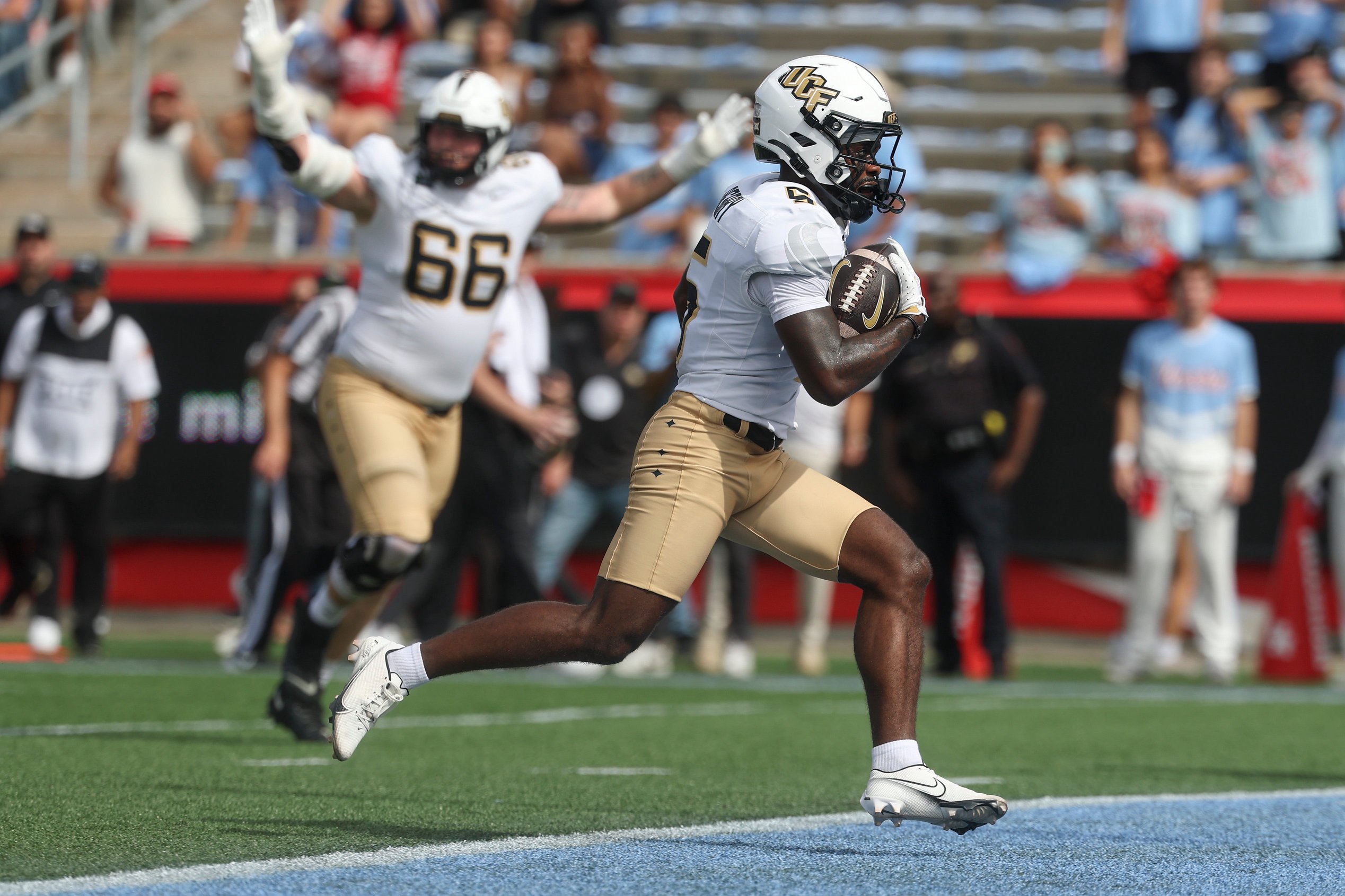 Oct 3, 2026; Houston, Texas, USA; UCF Knights wide receiver Josh Derry (5) scores a touchdown during the first quarter against the Houston Cougars at TDECU Stadium. Mandatory Credit: Troy Taormina-Imagn Images