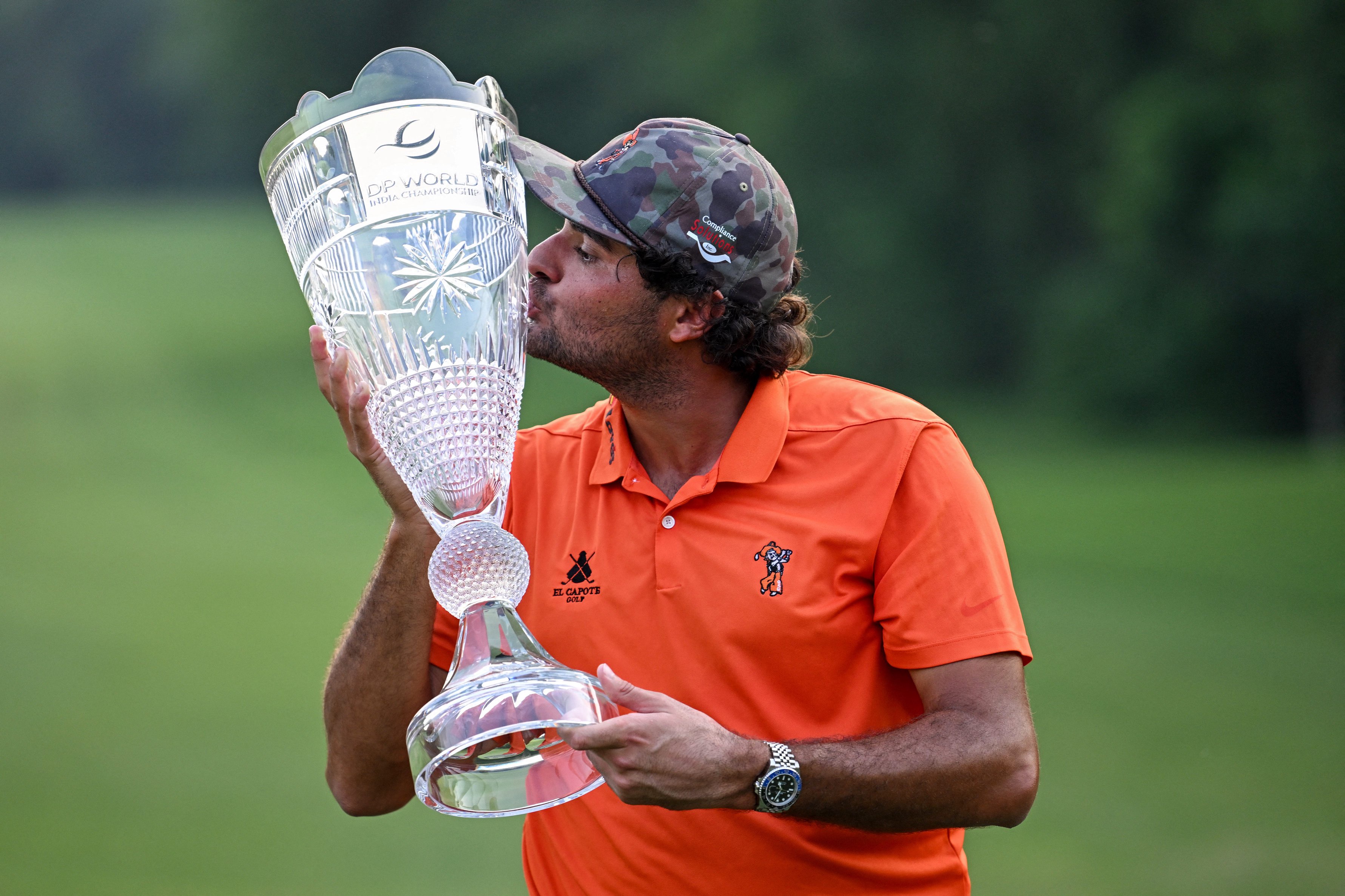 Spain's Eugenio Chacarra poses with the trophy after winning the 2026 DP World India Championship at the Delhi Golf Club in New Delhi, India. 