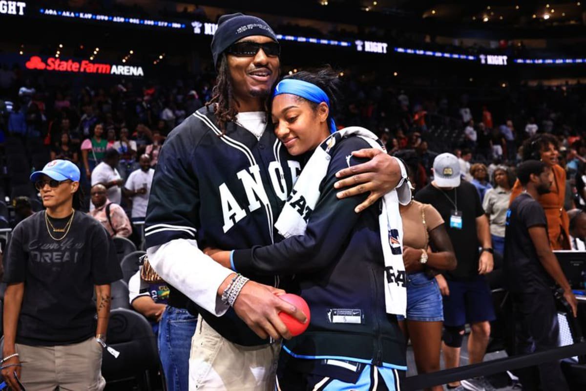 Angel Reese hugs Wendell Carter Jr. after a game against the Chicago Sky