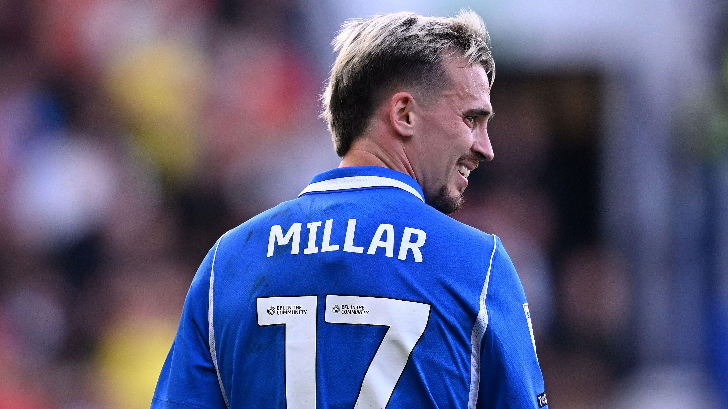 A smiling Liam Millar in a blue Birmingham City shirt