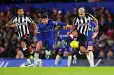 Enzo Fernandez of Chelsea in action with Bruno Guimaraes and Callum Wilson of Newcastle United during the Carabao Cup Quarter Final match between C...