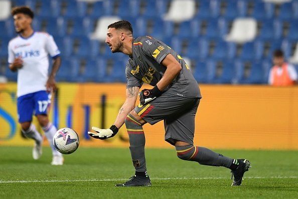 Lecce's Falcone rolling out the ball.