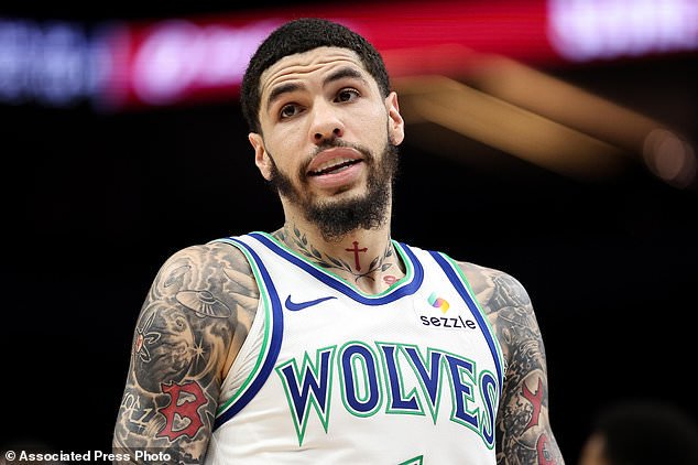 Minnesota Timberwolves guard LaMelo Ball (1) looks on during the second half of a preseason NBA basketball game against the Detroit Pistons Wednesday, Oct. 14, 2026, in Minneapolis. (AP Photo/Matt Krohn)