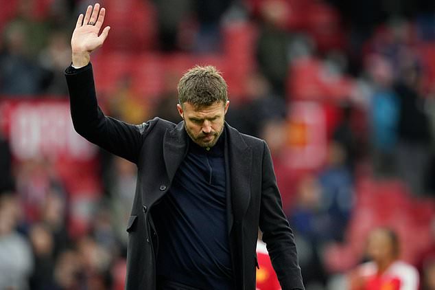 Manchester United's head coach Michael Carrick waves to supporters after his team lost the English Premier League soccer match between Manchester United and Bournemouth in Manchester, England, Sunday, Oct. 25, 2026. (AP Photo/Dave Thompson)