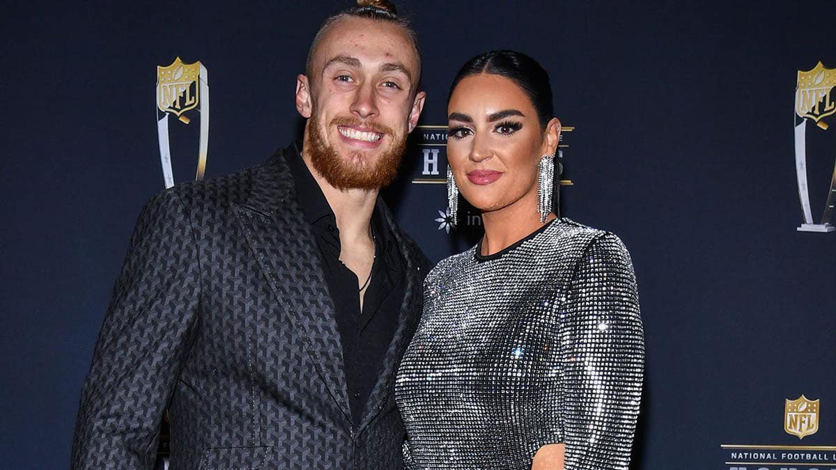 George Kittle and Claire Kittle walk on the red carpet at NFL Honors in Phoenix.