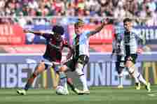 Joshua Zirkzee of Bologna FC and Thomas Thiesson Kristensen of Udinese Calcio battle for possession during the Serie A TIM match between Bologna FC...