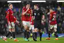 Referee Jarred Gillett is confronted by Harry Maguire of Manchester United after awarding a penalty to Chelsea during the Premier League match betw...