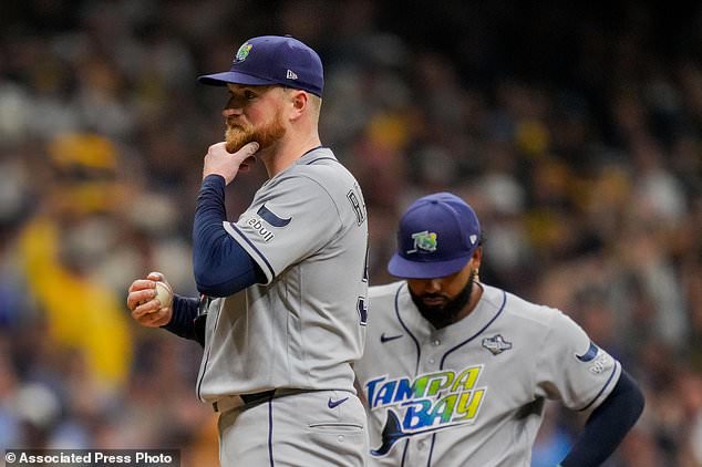 Tampa Bay Rays pitcher Drew Rasmussen looks away before leaving the game during the fourth inning of Game 2 of baseball's World Series, Saturday, Oct. 24, 2026, in Milwaukee, between the Milwaukee Brewers and the Tampa Bay Rays. (AP Photo/Ashley Landis)