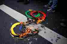 Protestors set fire to some makeshift Olympic rings to demonstrate their outrage