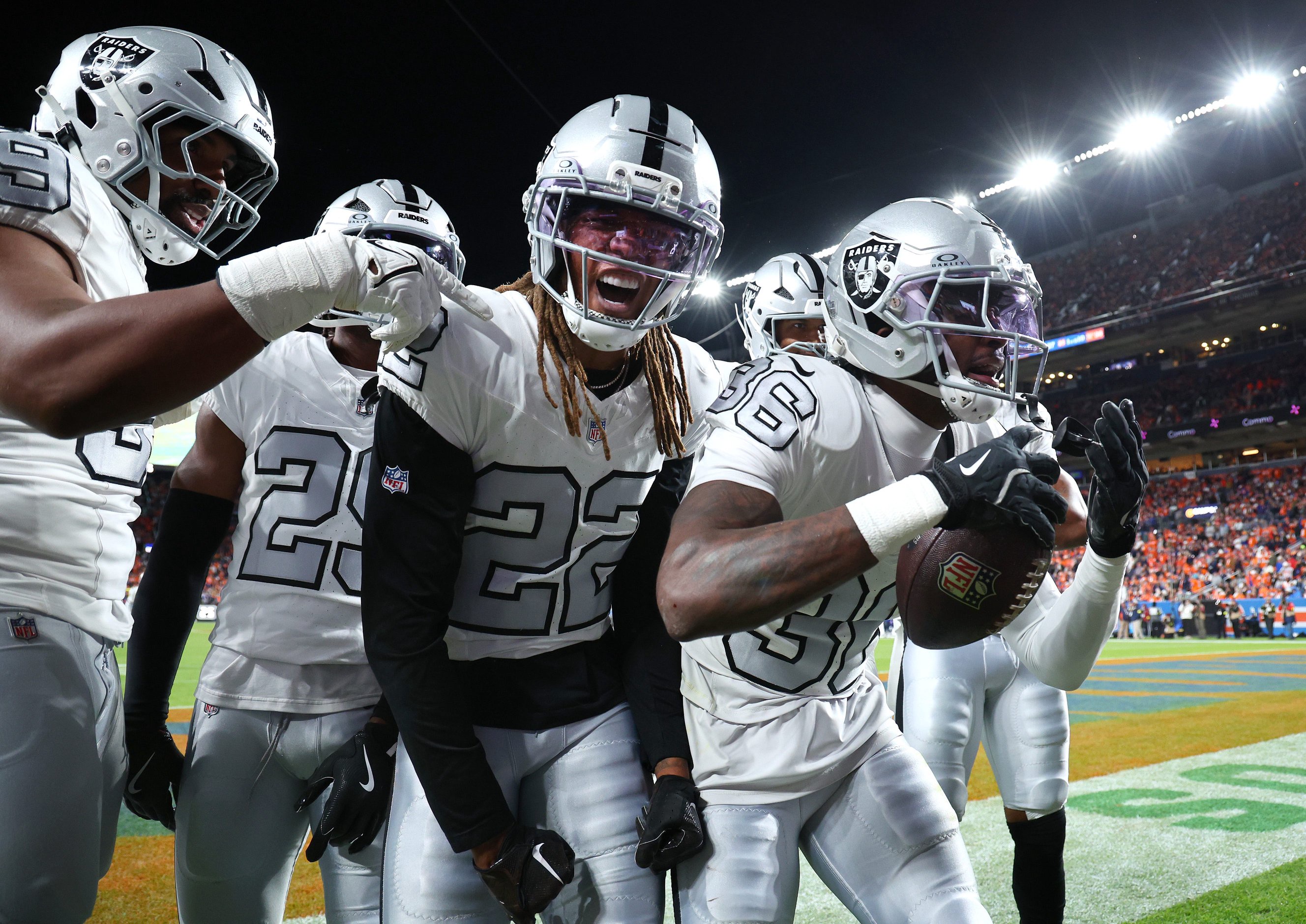 DENVER, COLORADO - NOVEMBER 06: Kyu Blu Kelly #36 of the Las Vegas Raiders celebrates with Eric Stokes #22 after intercepting a pass thrown by Bo Nix #10 of the Denver Broncos during the second quarter in the game at Empower Field At Mile High on November 06, 2025 in Denver, Colorado. (Photo by Jamie Schwaberow/Getty Images)