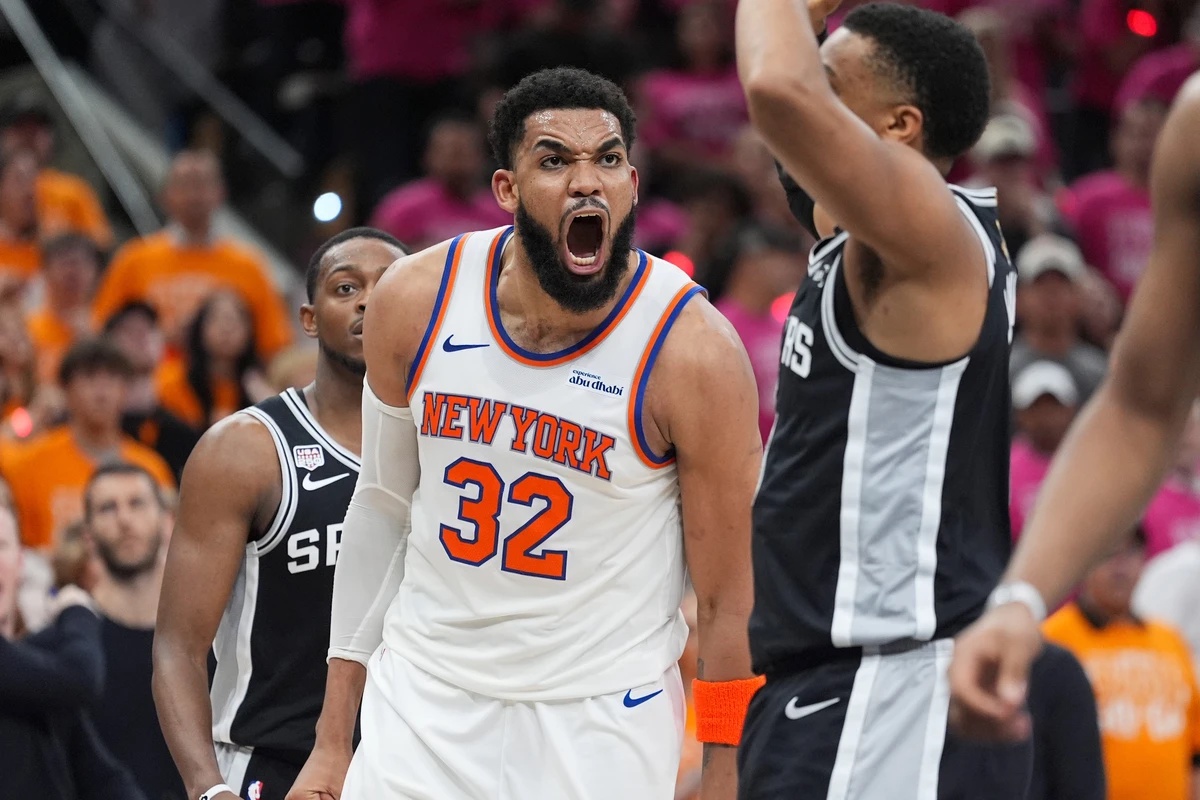 New York Knicks center Karl-Anthony Towns (32) yells during the second half of Game 1 of the NBA Finals basketball series against the San Antonio Spurs, Wednesday, June 3, 2026, in San Antonio. (AP Ph ...