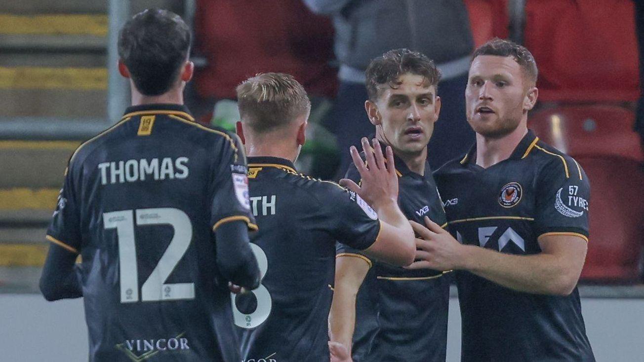 Newport County players Joe Thomas, Matt Smith, Harrison Biggins and Lee Jenkins
