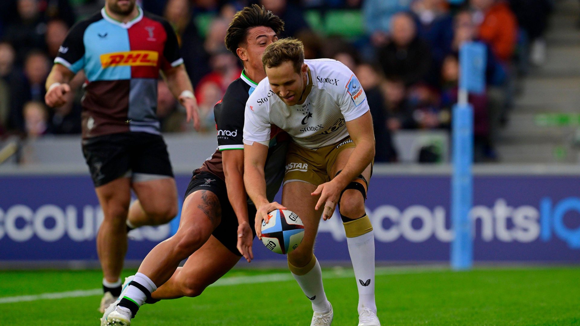 Marcus Smith slaps the ball out of Max Malins' hand as he tries to dot down a try in the first-half 