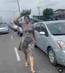 "God Bless Your Hustle" Reactions As Nollywood Actress, Adunni Ade Hawks Walnut On The Street 9