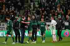 James Forrest of Celtic embraces Angelos Postecoglou, Manager of Celtic following victory in the UEFA Europa League group G match between Ferencvar...