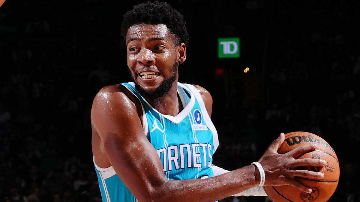 Brandon Miller drives to the basket against the Boston Celtics.
