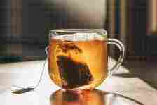 a photo of tea in a glass mug