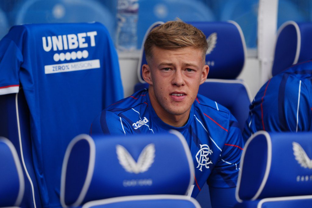Rangers player Connor Barron sitting in the dugout.