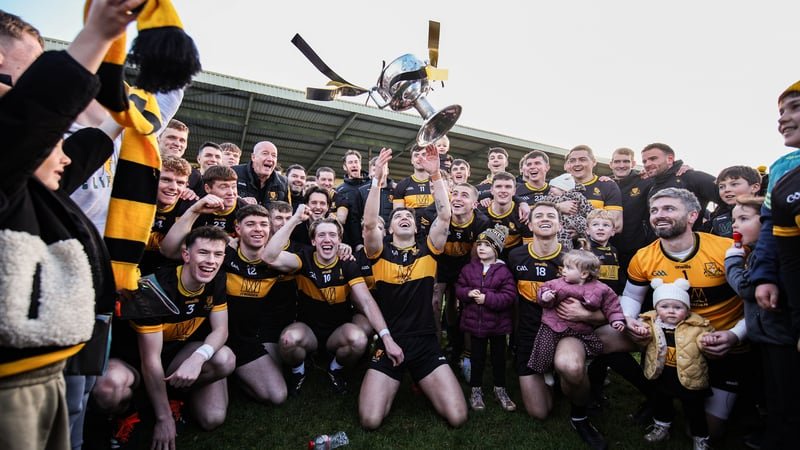 25 October 2026; Dr Crokes captain Tony Brosnan and teammates celebrate with the Bishop Moynihan cup after the Kerry County Senior Football Championship final match between Dr Crokes and Kenmare Shamrocks at Fitzgerald Stadium in Killarney, Kerry. Photo b