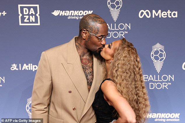 Presenter Kate Scott shard a kiss with her husband Malik Scott on the red carpet ahead of hosting the Ballon d'Or ceremony