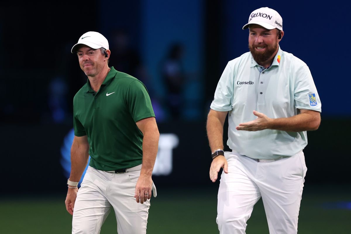Rory McIlroy of Boston Common Golf and Shane Lowry of The Bay Golf Club talk during the match at SoFi Center on January 26, 2026 in Palm Beach Gardens, Florida.