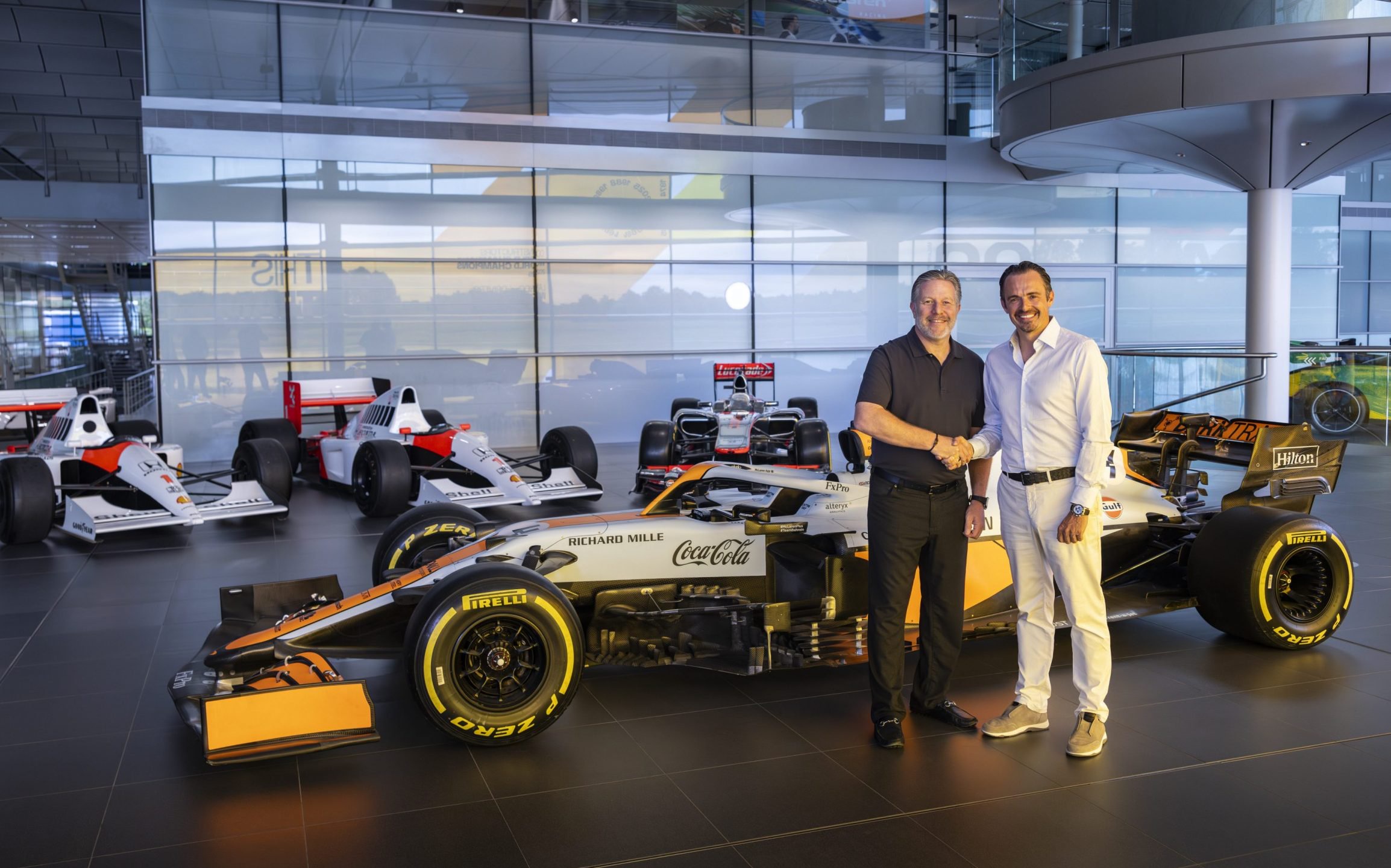 Zak Brown and Tom Hartley Jnr with the collection