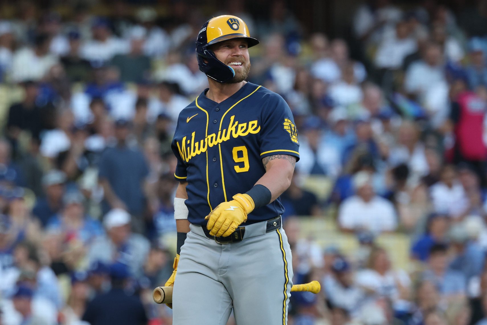 Jake Bauers #9 of the Milwaukee Brewers reacts after striking out against the Los Angeles Dodgers during the second inning in game four of the National League Championship Series at Dodger Stadium on October 15, 2026 in Los Angeles, California.
