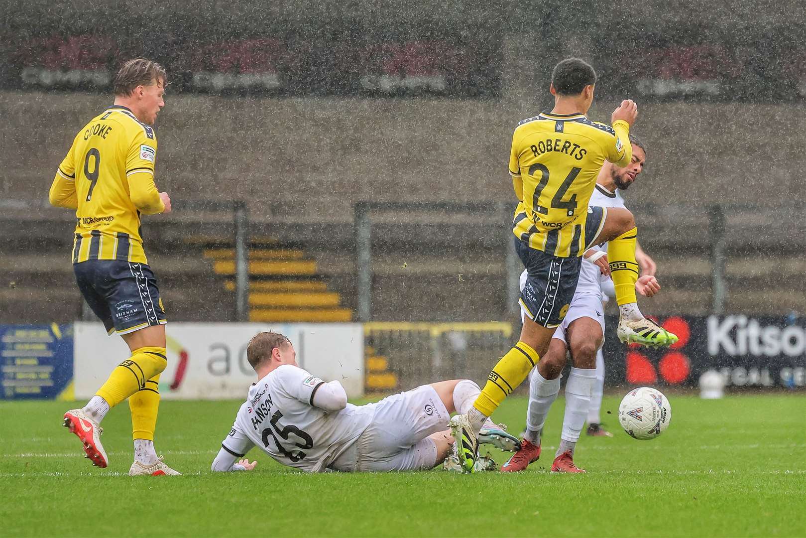 Ryan Hanson slides in to win the ball against his old club. Picture: Helen Cooper