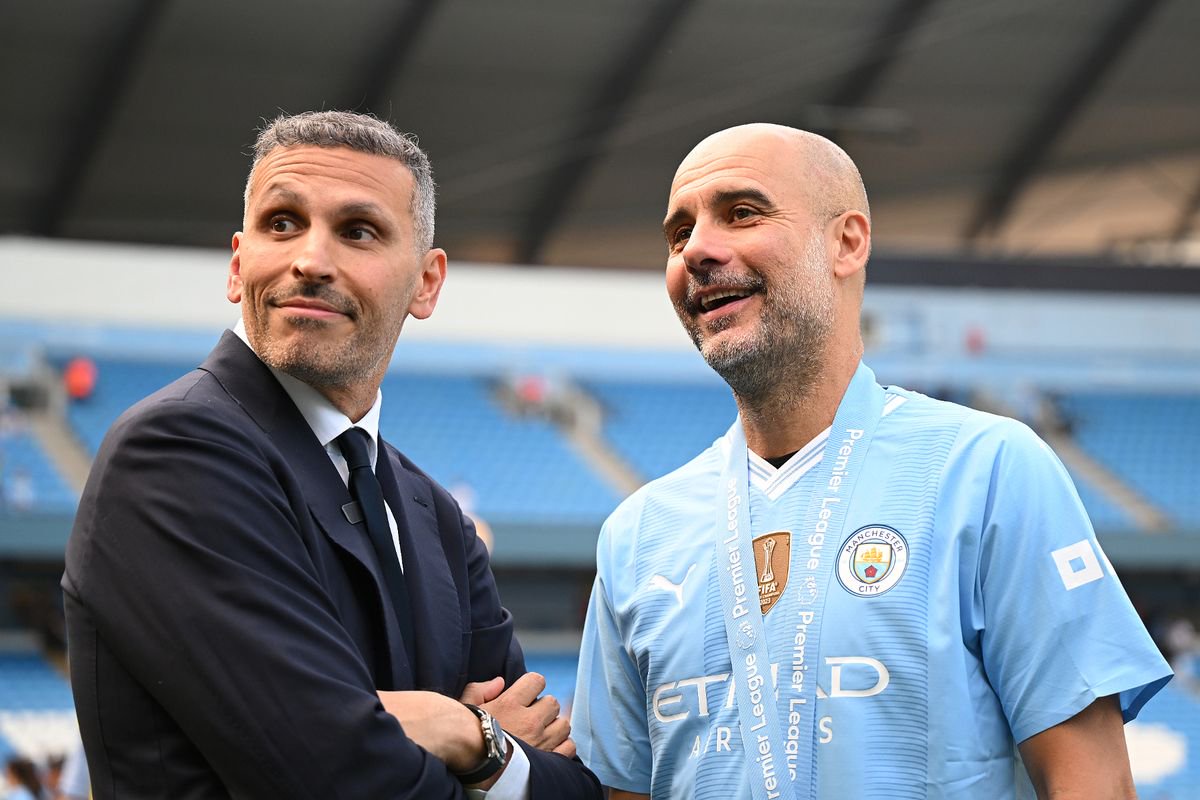 Khaldoon Al Mubarak, Chairman of Manchester City, and Pep Guardiola following the team's victory in the Premier League match between Manchester City and West Ham United. 