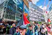 A Barclays' bank is seen in the background of the pro-Palestine protest in London today