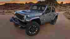 3/4 side view of 2024 Jeep Wrangler Rubicon 396 dirt trail
