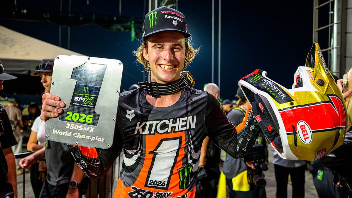 Levi Kitchen holds his 2026 Monster Energy SMX 250 Class World Championship trophy