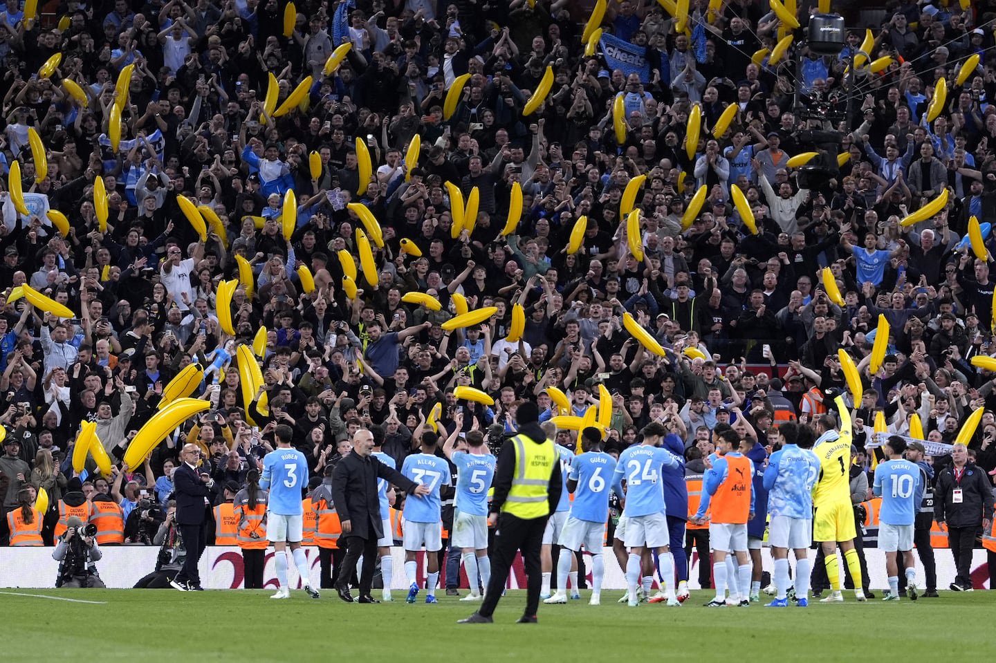 Manchester City celebrate victory at Anfield .