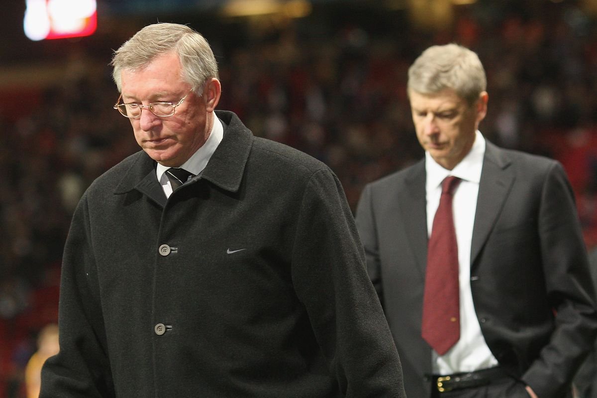 Sir Alex Ferguson of Manchester United and Arsene Wenger walk off after the UEFA Champions League Semi-Final first leg match between Manchester United and Arsenal at Old Trafford