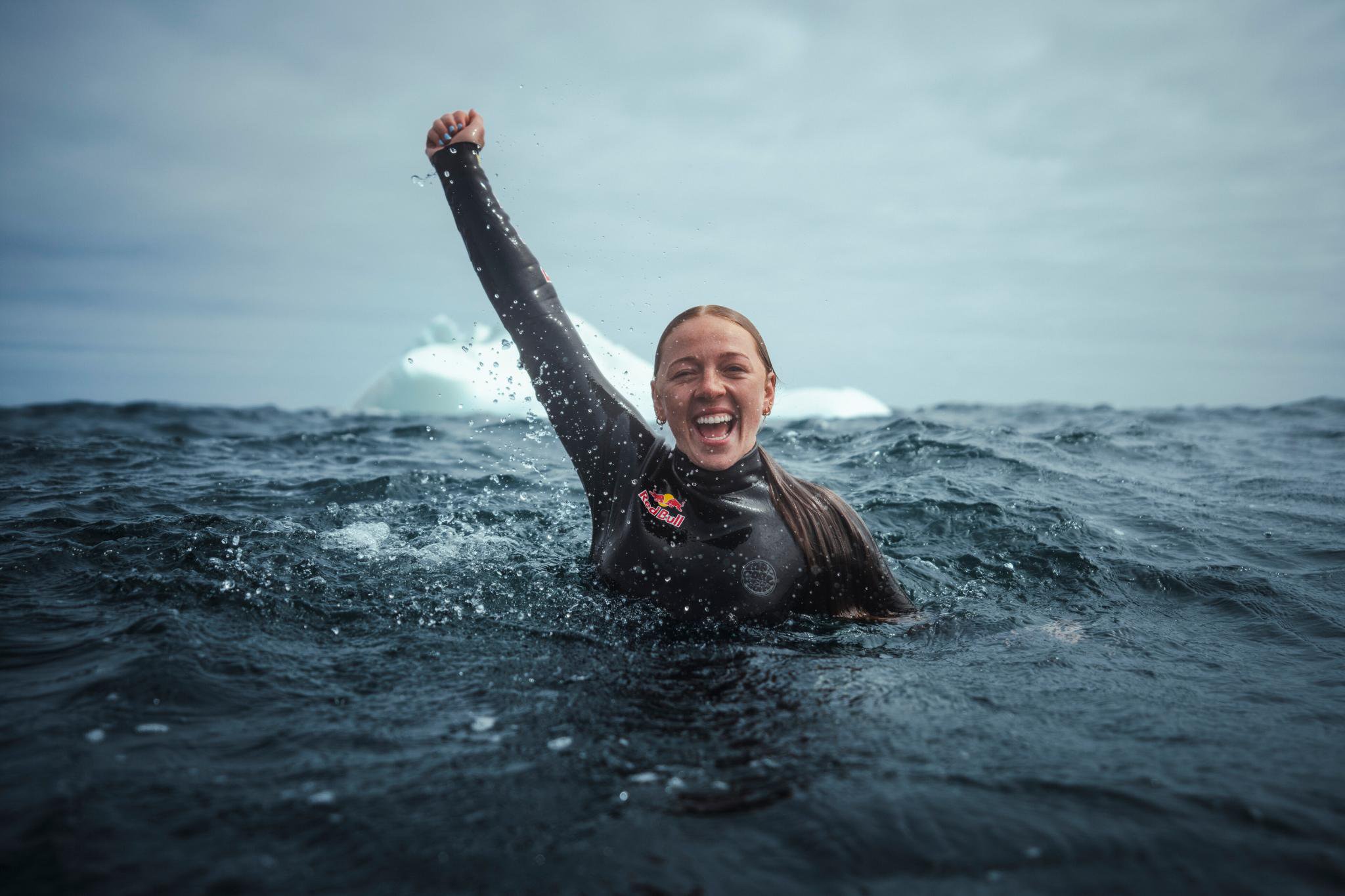 Molly Carlson poses for a photo after successfully diving off an iceberg during the Red Bull Iceberg Dive in Twillingate, Canada.