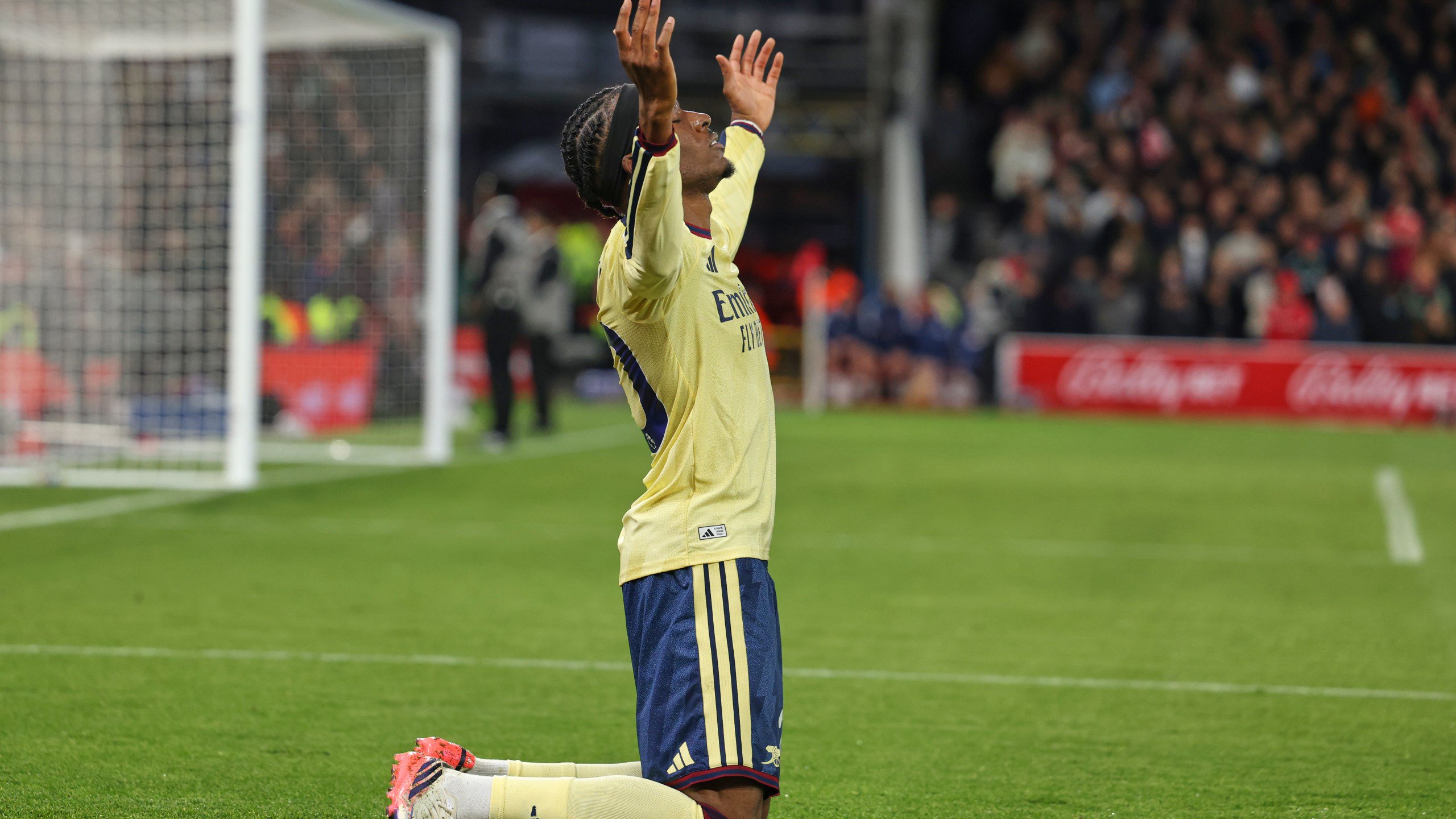 Arsenal's Noni Madueke celebrates after scoring his side's opening goal during the English Premier League soccer match between Nottingham Forest and Arsenal in Nottingham, England, Sunday, Oct. 18, 2026. (AP Photo/Maddy Grassy)