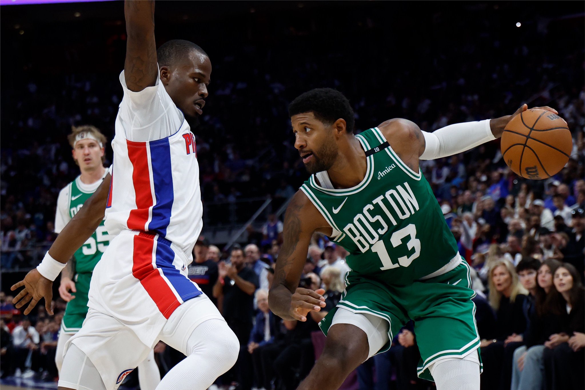 Oct 20, 2026; Detroit, Michigan, USA;  Boston Celtics forward Paul George (13) dribbles defended by Detroit Pistons guard Javonte Green (31) in the second half at Little Caesars Arena.  Mandatory Credit: Rick Osentoski-Imagn Images